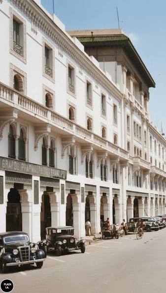 Historic Casablanca boulevard scene with arcades, balconies and the Grande Pharmacie du Maroc