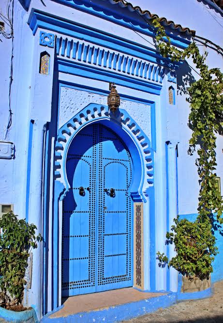 A traditional decorated blue door in the medina of Chefchaouen