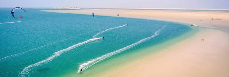 Dakhla Lagoon panorama — the wide, calm waters flanked by Saharan dunes and Atlantic light