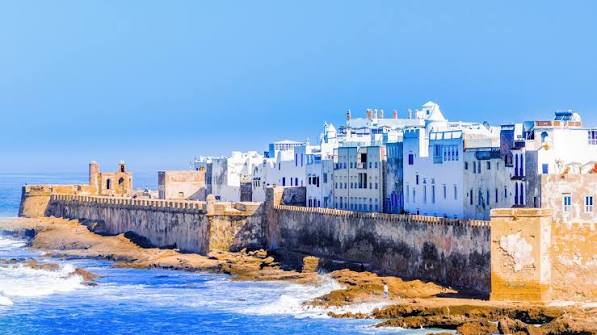 Essaouira's Atlantic beach — typical coastal conditions that attract travelers seeking relief from Morocco's interior heat