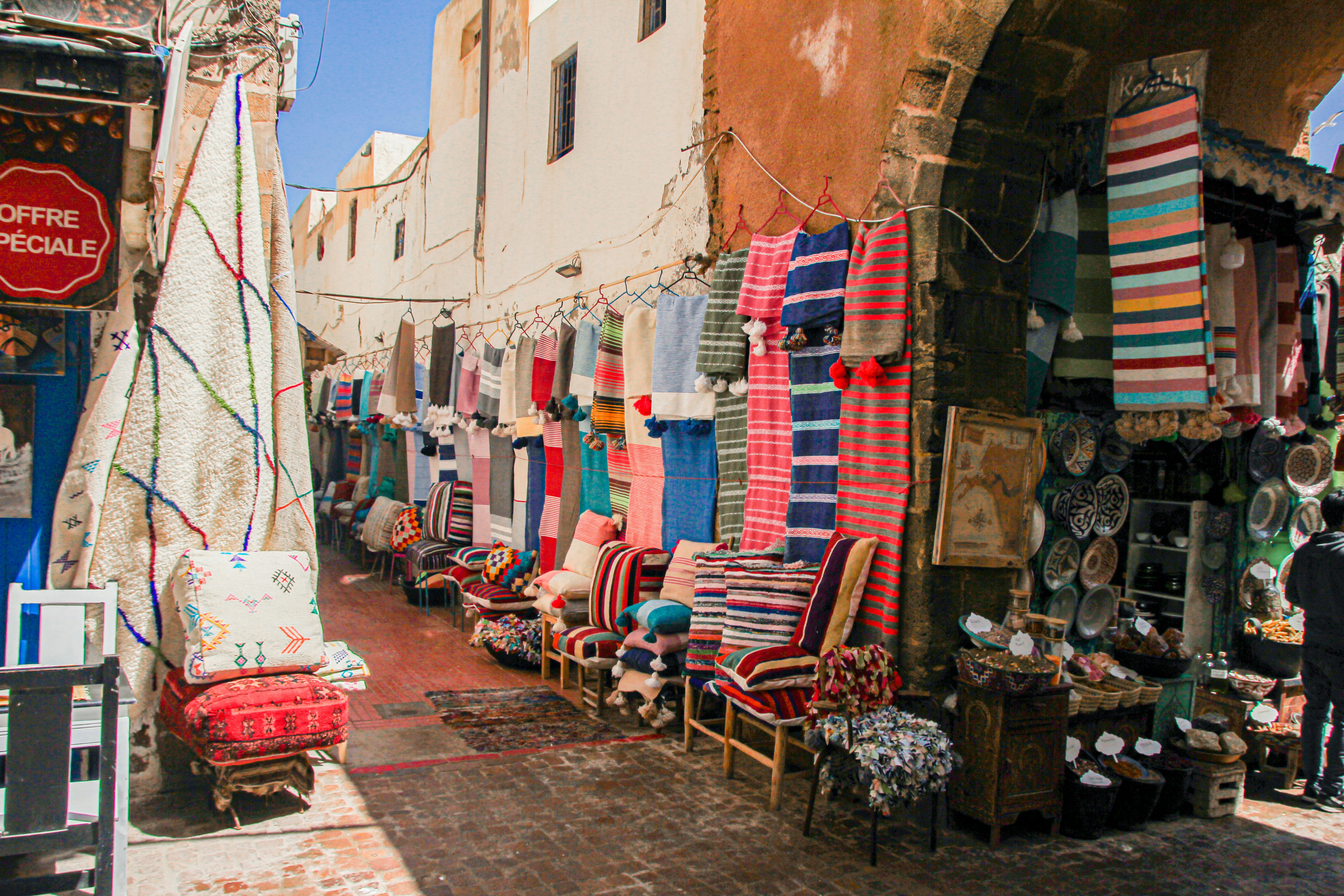 Whitewashed medina streets of Essaouira with blue trim and arched doorways