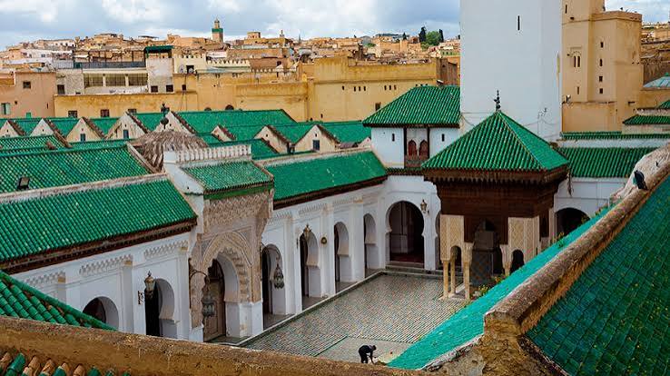 The Al-Qarawiyyin mosque in Fes el-Bali — founded in 859 CE and expanded by the Andalusian refugee community, it is the oldest continuously operating university in the world and the intellectual heart of Moroccan-Andalusian culture