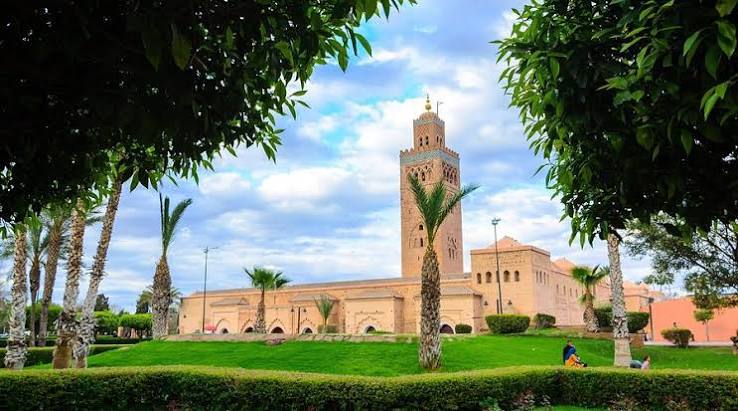 Koutoubia Mosque minaret rising above the palms of Marrakech