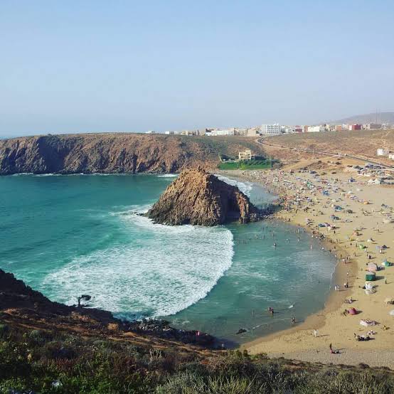 Mirleft Atlantic coast — cliff-backed coves and open ocean south of Agadir