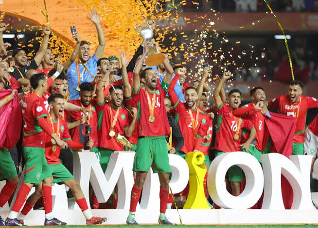 Morocco's CHAN squad lift the trophy after their record third African Nations Championship title in 2025, defeating Madagascar 3–2