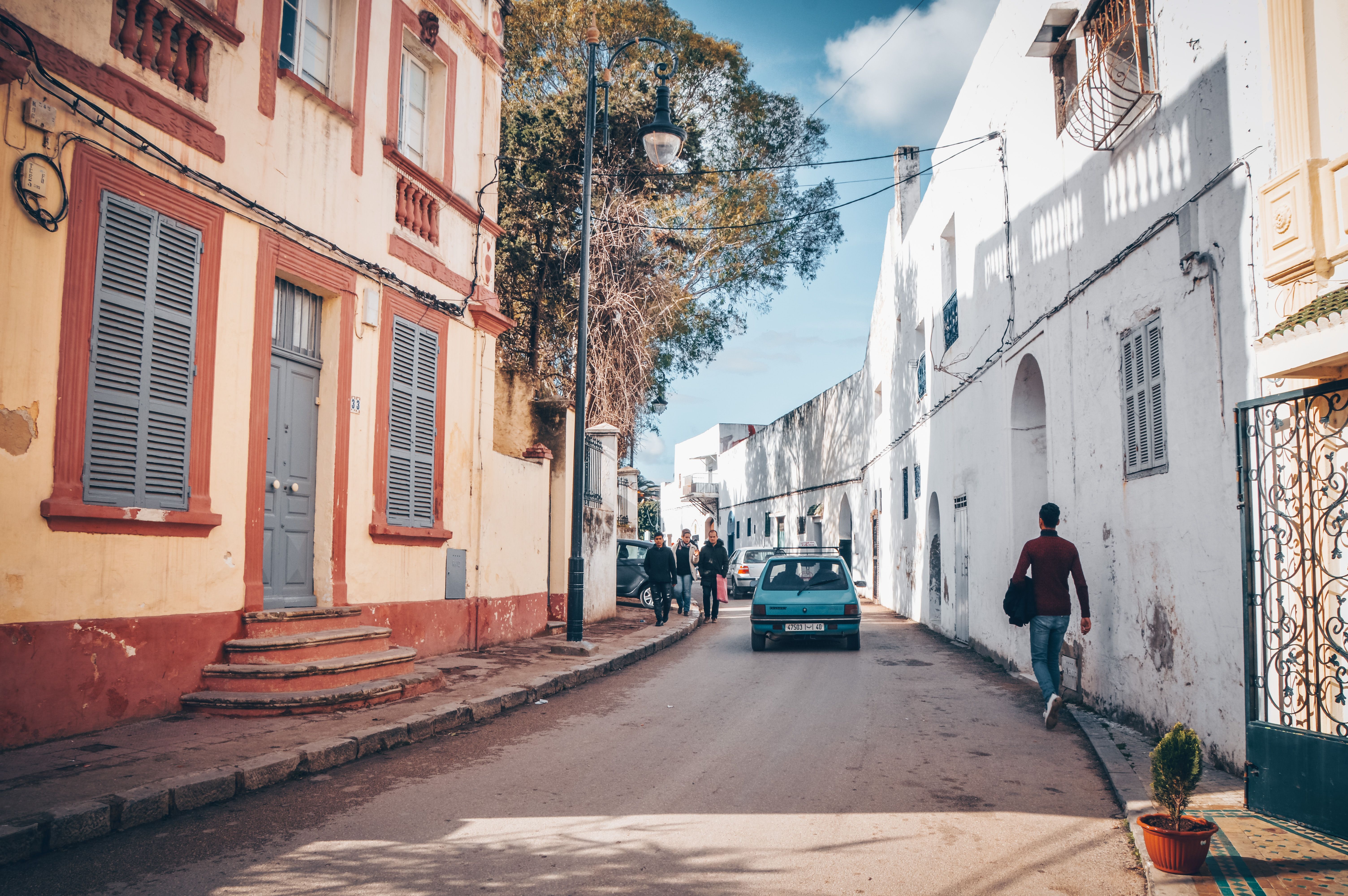 Colourful street in Tangier's medina with shuttered facades