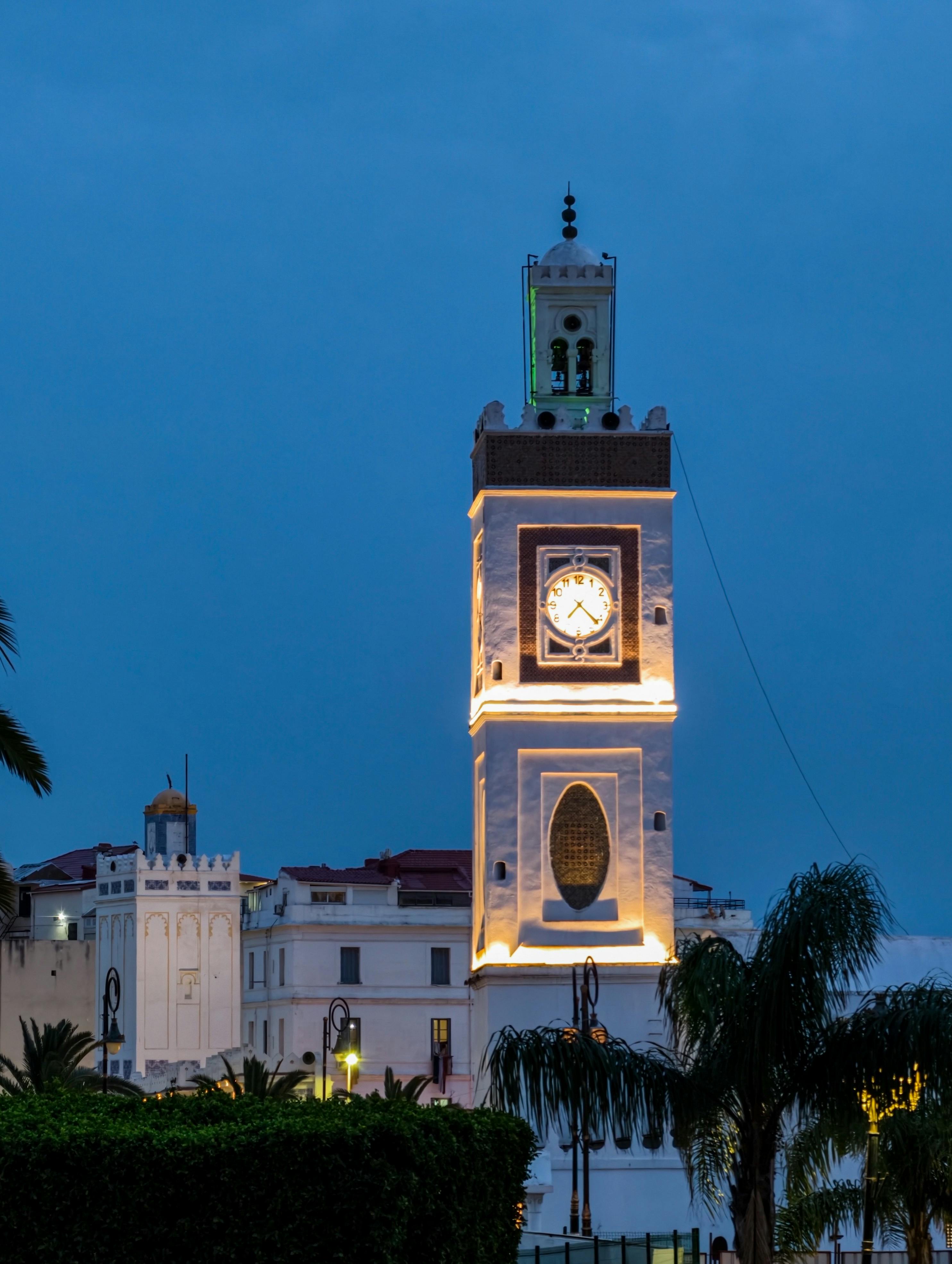 Tangier clock tower illuminated at blue hour